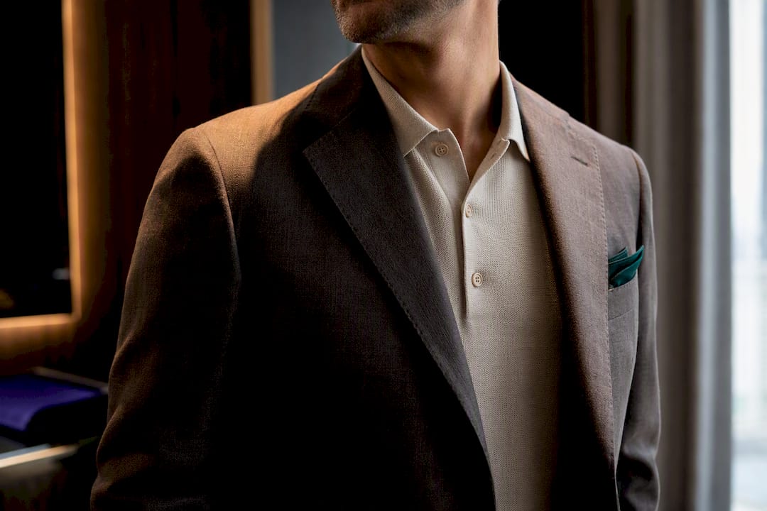 Polo collar neatly worn beneath blazer lapel